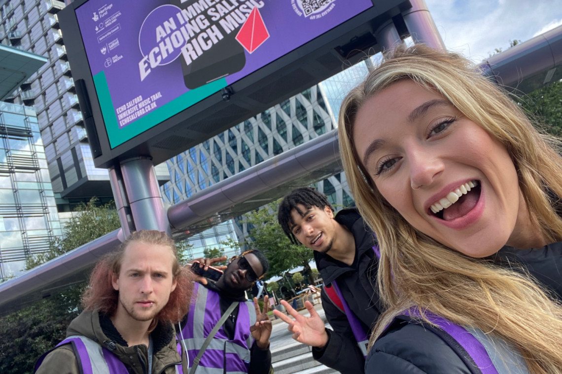 smiling student trainees celebrate the launch of the Echo Salford app